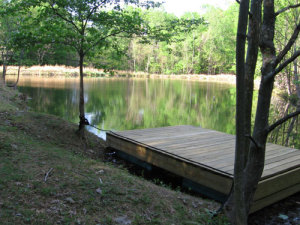 Take the oars to steer the swimming dock to the middle of the pond, and jump in. The pond straddles land owned by StillPoint and the Rolling Ridge Foundation.